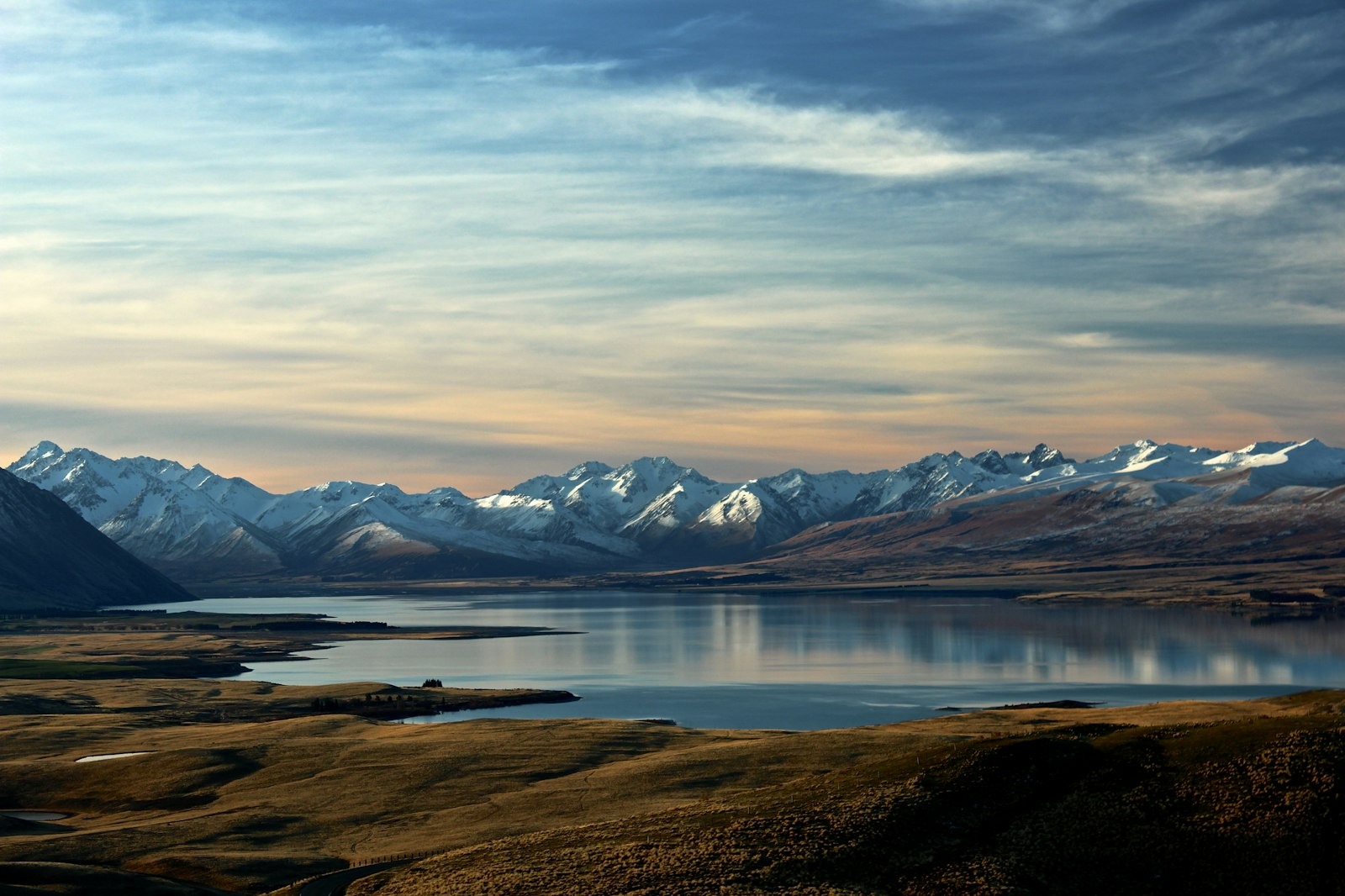 Rolling green valley beneath a wide southern sky