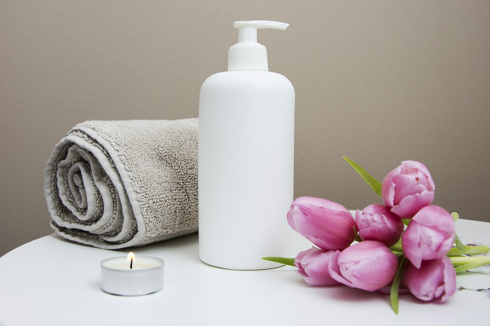 Hot stones arranged along a towel for a signature spa ritual